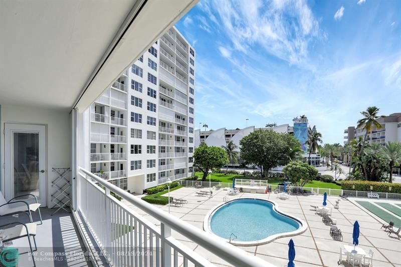 a view of swimming pool from a balcony