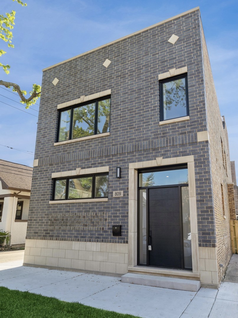 a front view of a house with garage