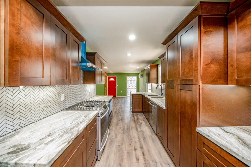 a hallway with a large kitchen island