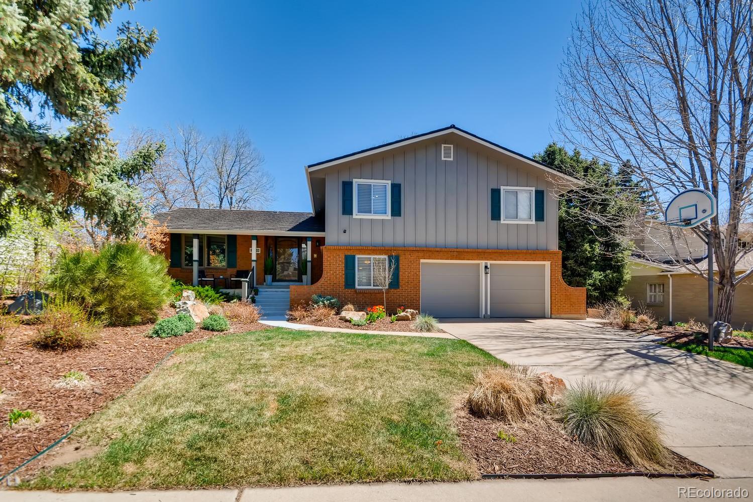 a front view of house with yard outdoor seating and barbeque oven