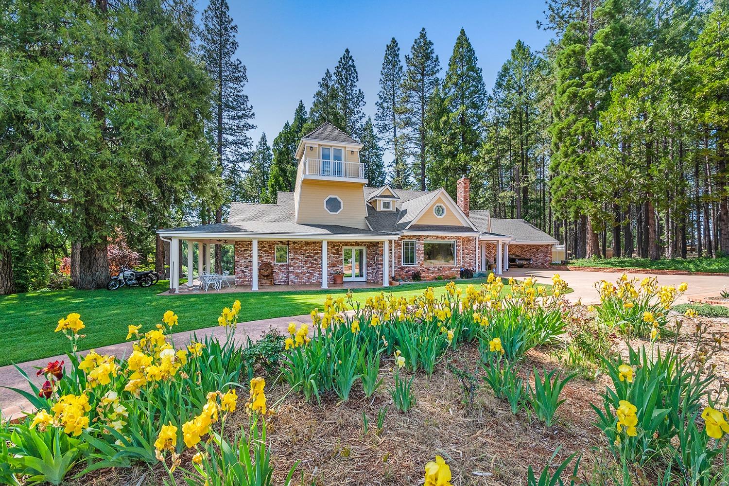 a front view of a house with garden