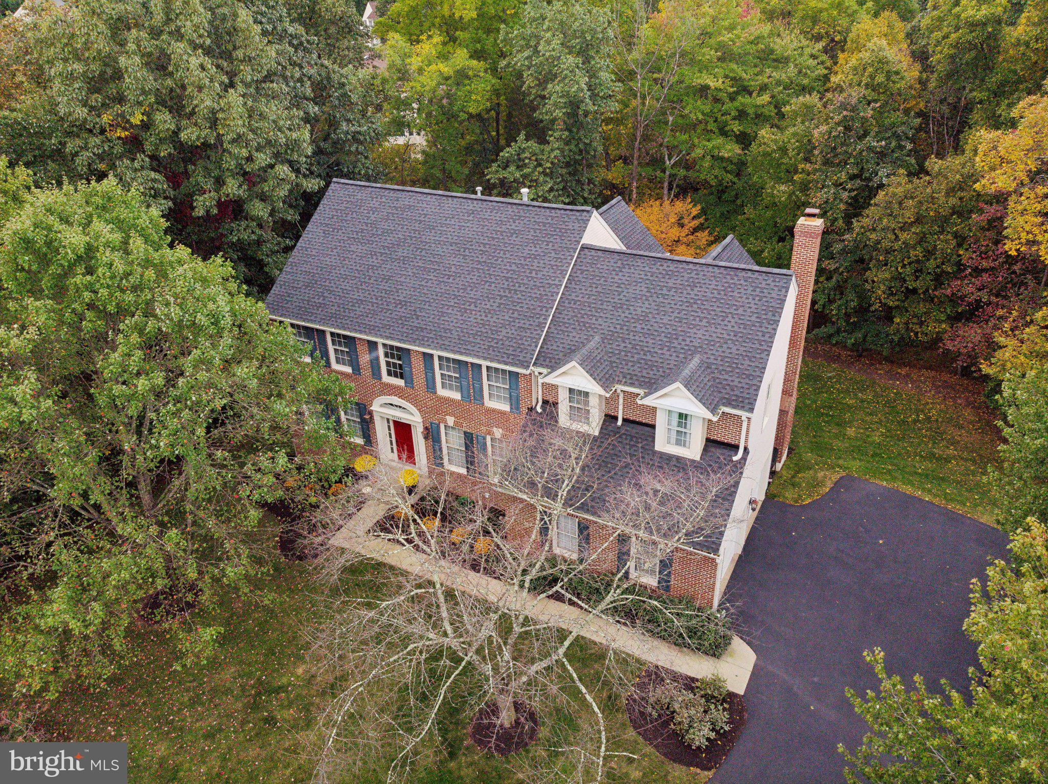 aerial view of a house with a yard