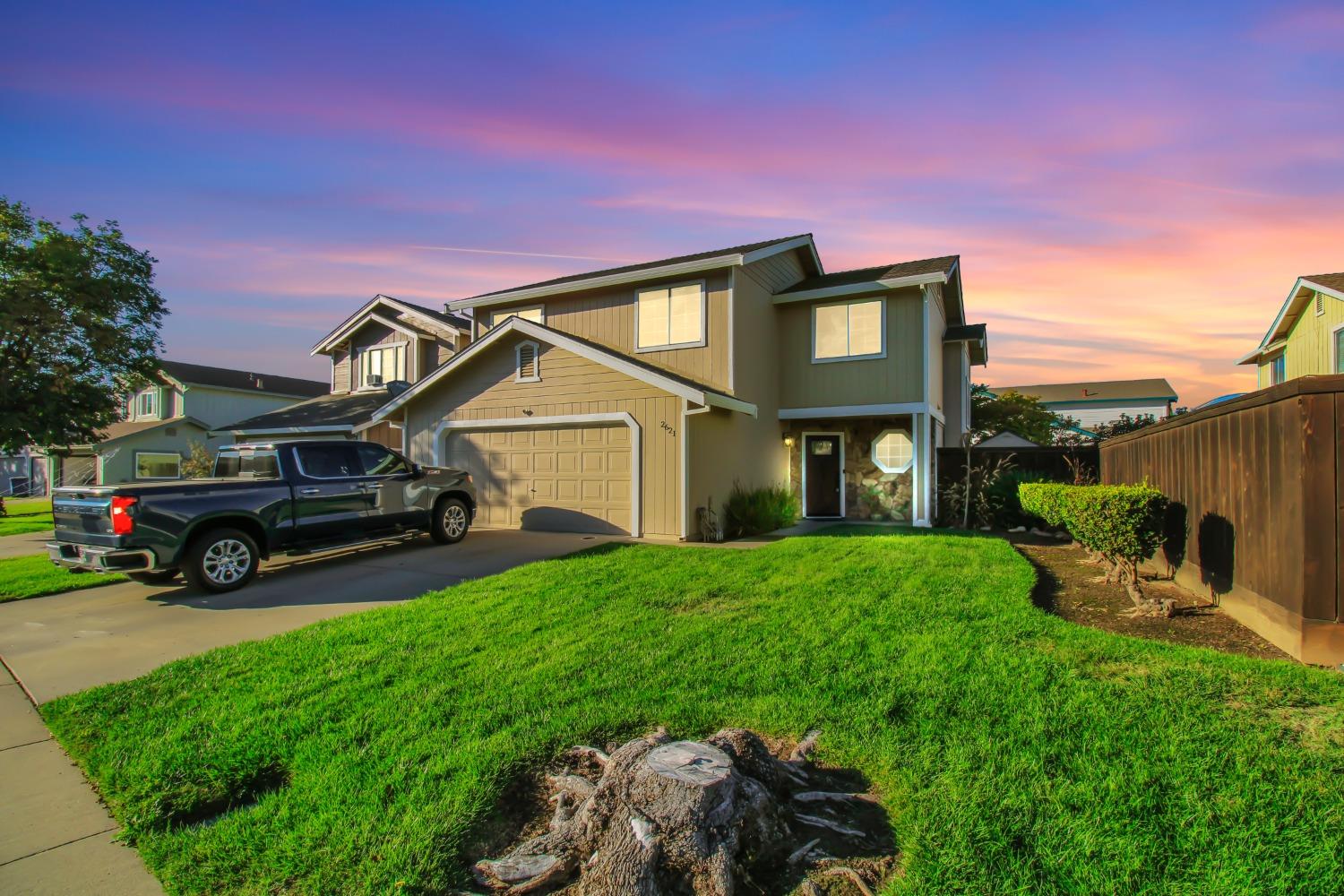 a view of a house with a back yard