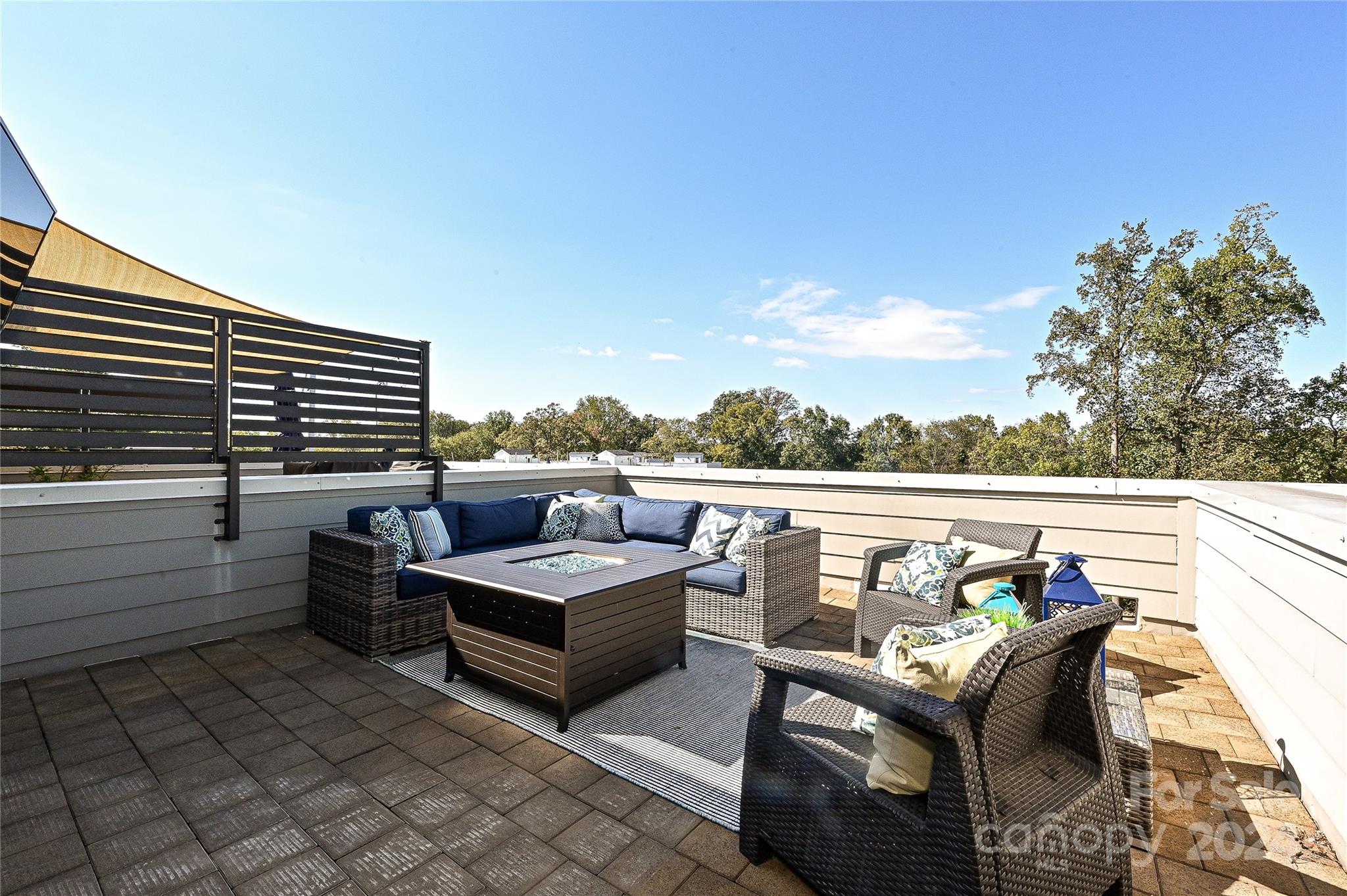 a terrace view with seating space and barbeque oven