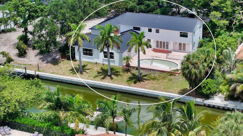 an aerial view of house with swimming pool