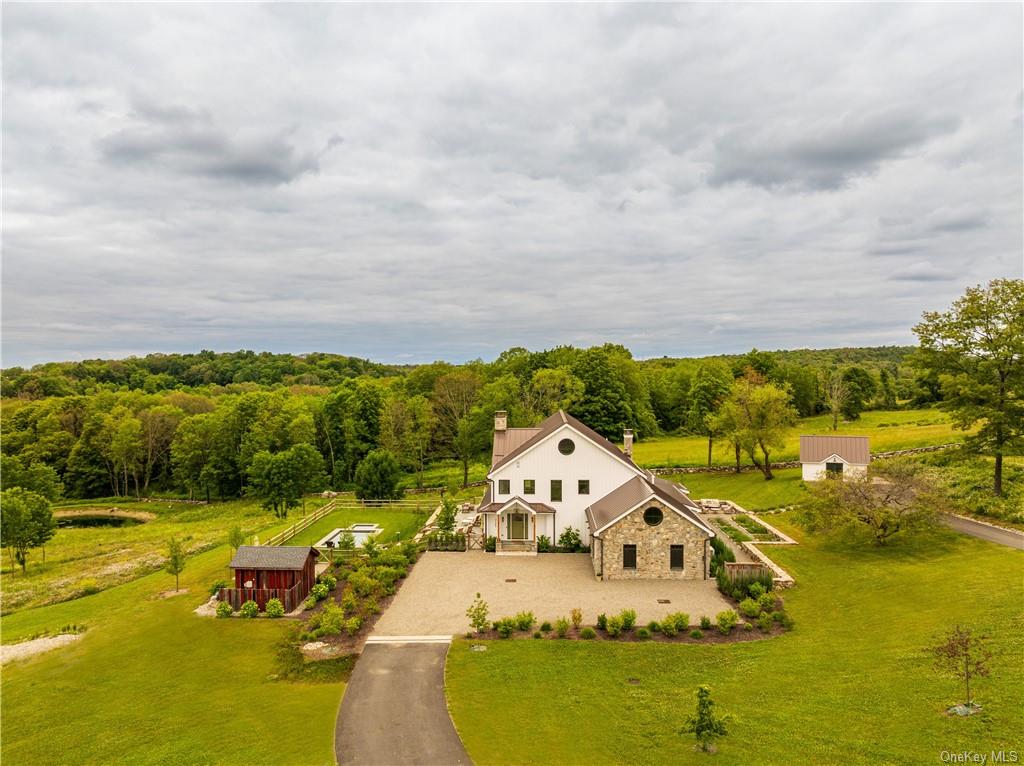 an aerial view of a house with a garden