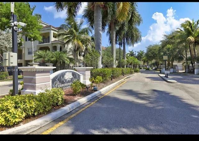 a row of palm trees and a park view