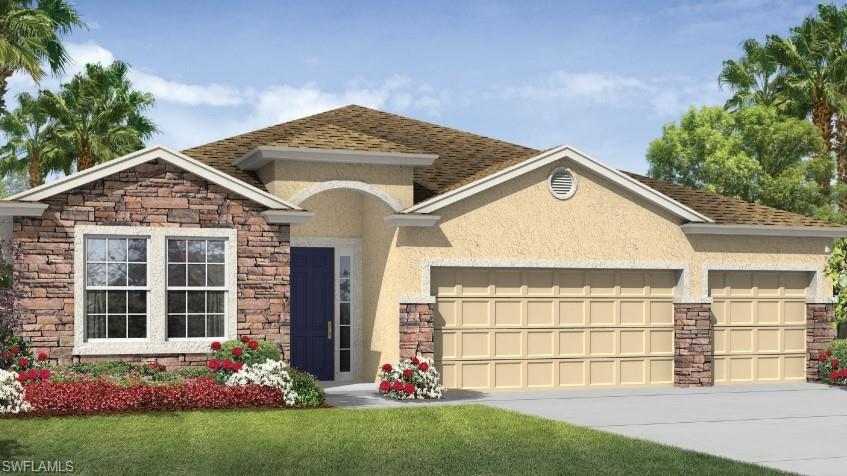 View of front of house with a garage and a front yard