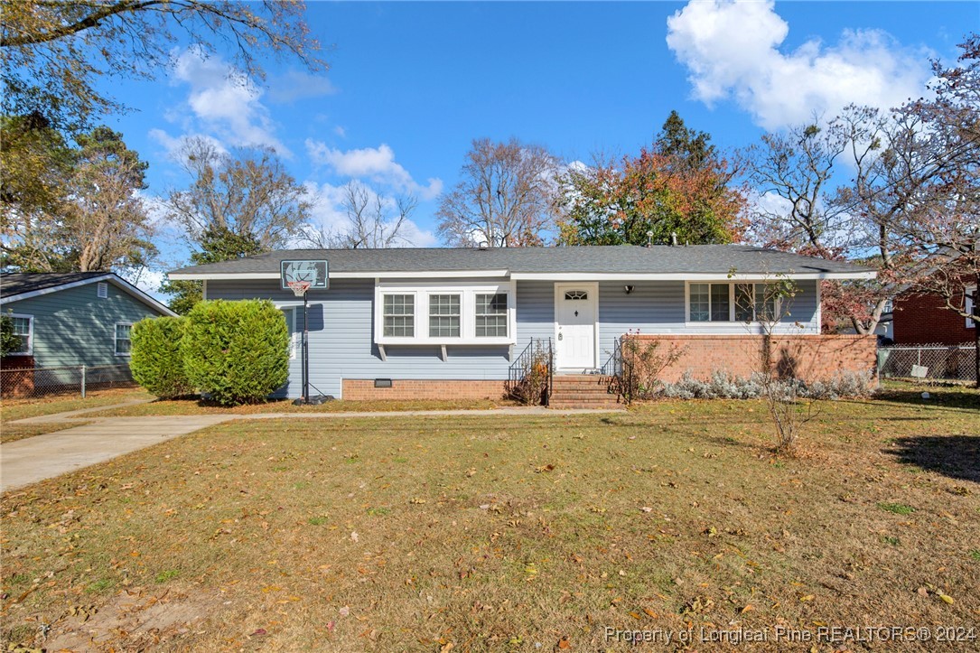 front view of a house with a yard