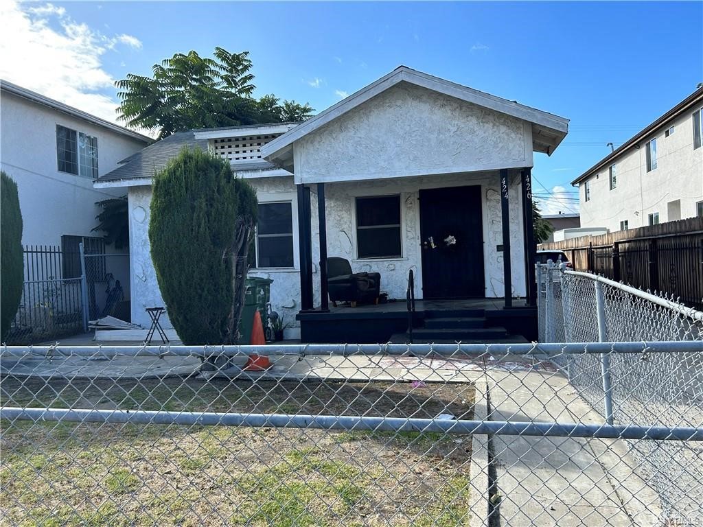 a view of a house with a small yard