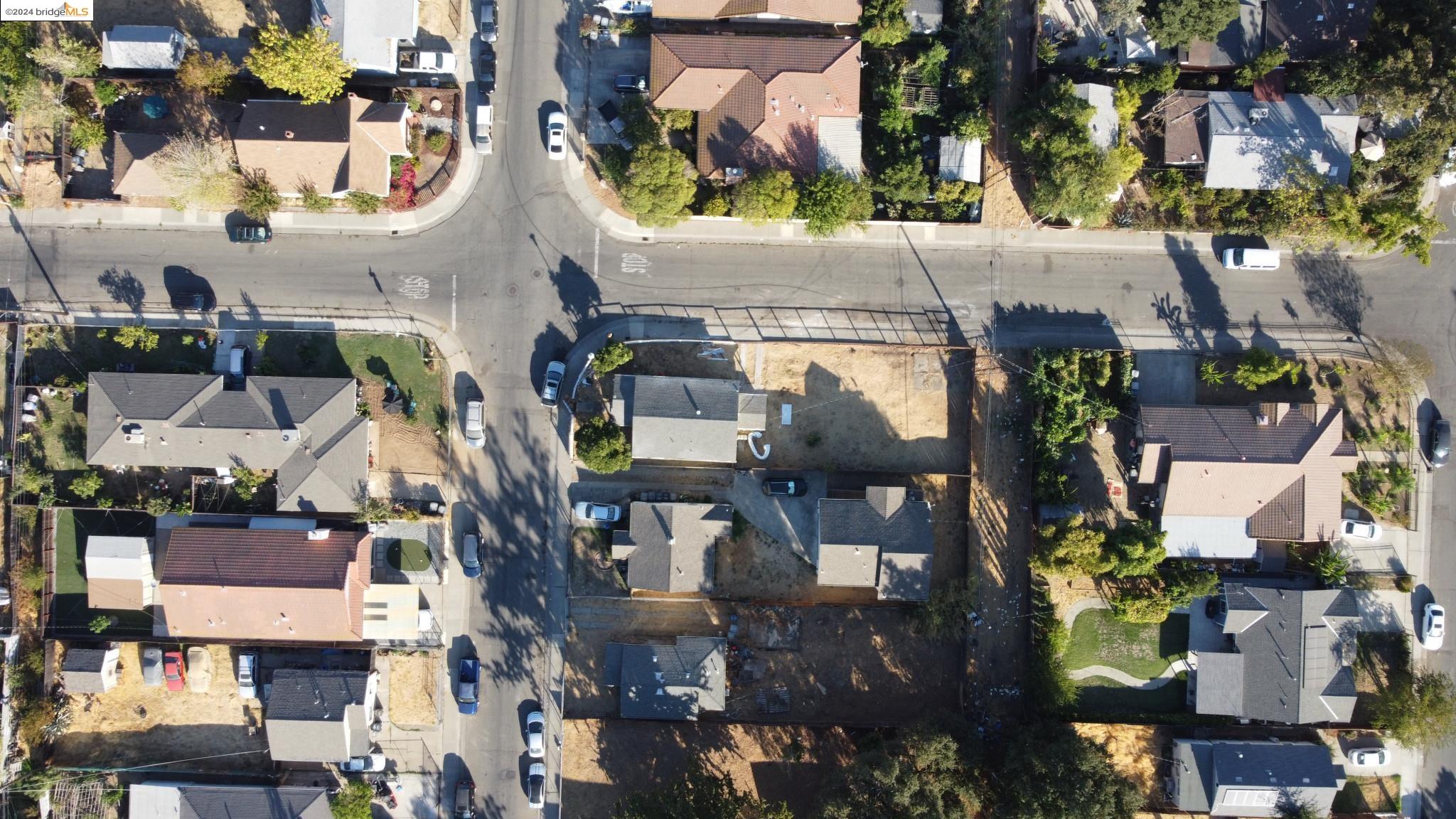 an aerial view of houses with outdoor space