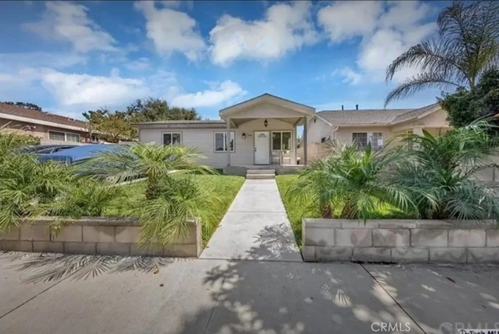 front view of a house with a yard