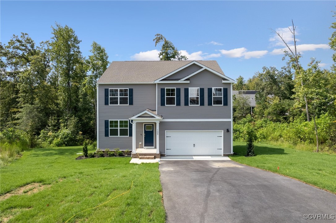 View of front of property featuring a garage and a