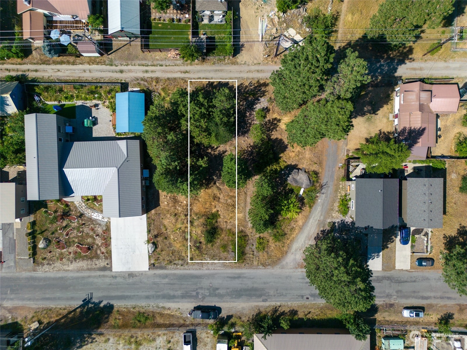 an aerial view of a house with a yard and potted plants