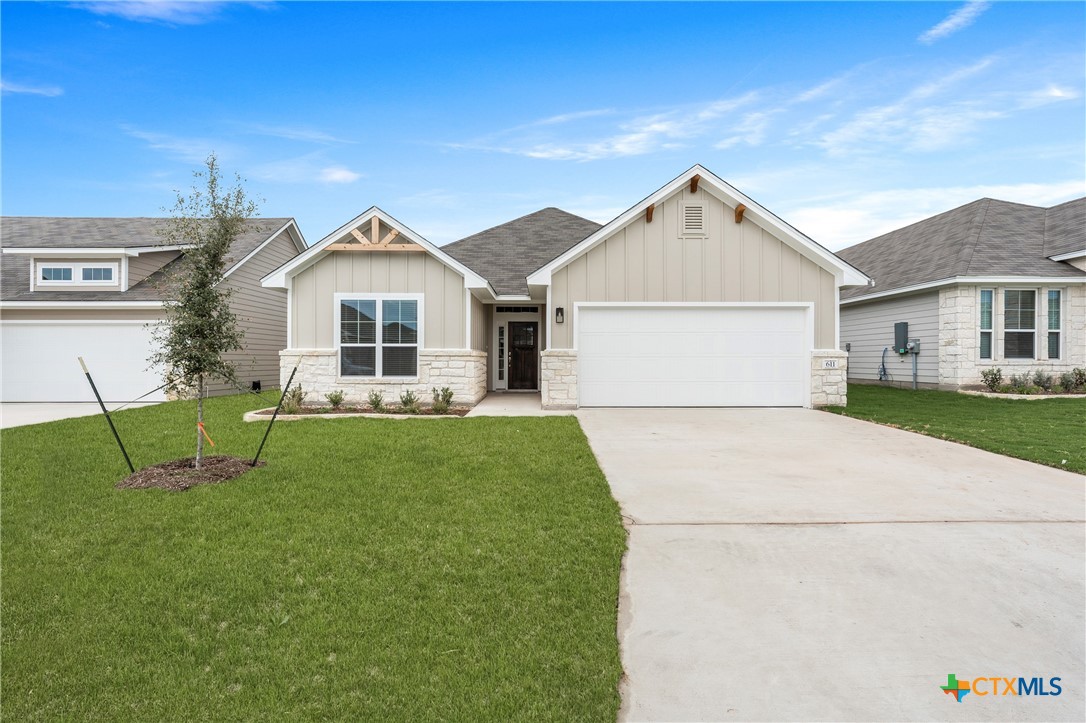 a view of outdoor space yard and front view of house