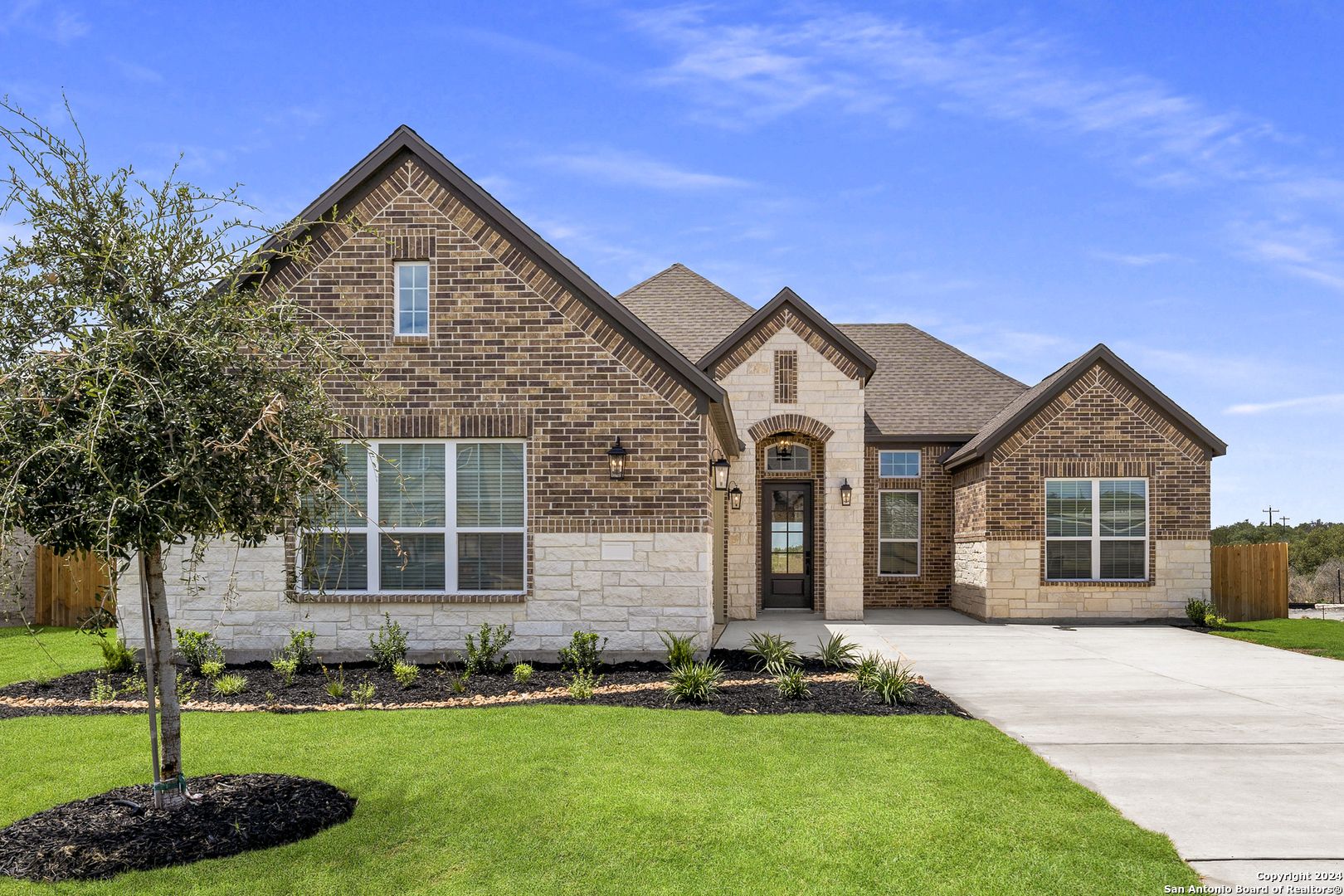 a front view of a house with a yard