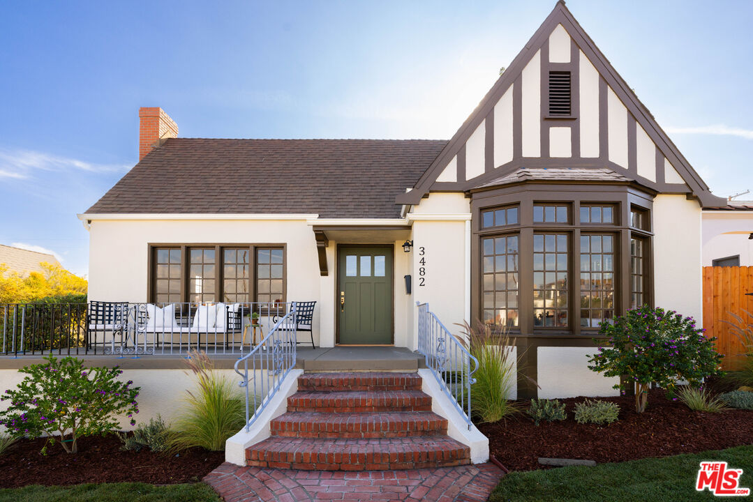 a front view of a house with a porch