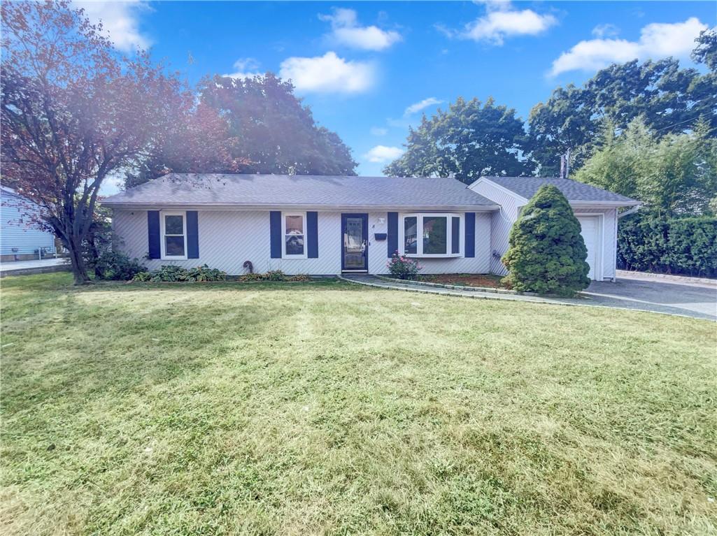 front view of a house with a yard