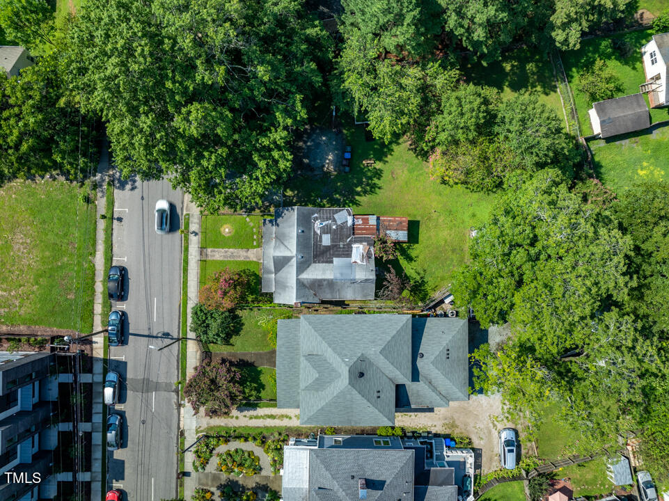 an aerial view of residential houses with outdoor space