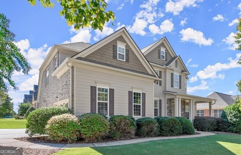 a front view of a house with a yard