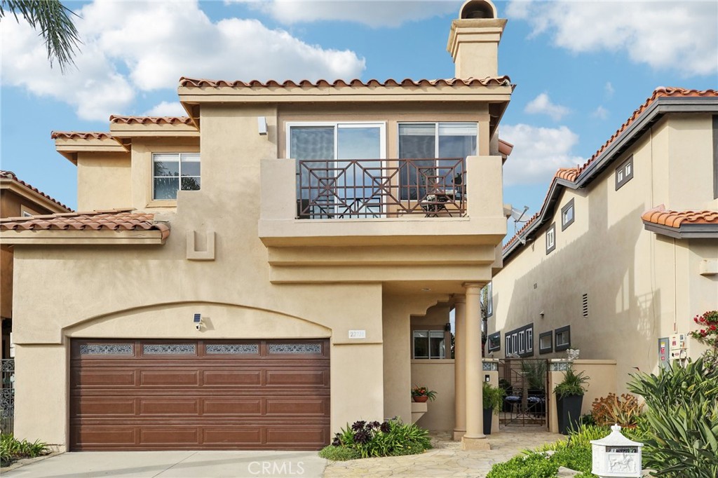 a front view of a house with garage