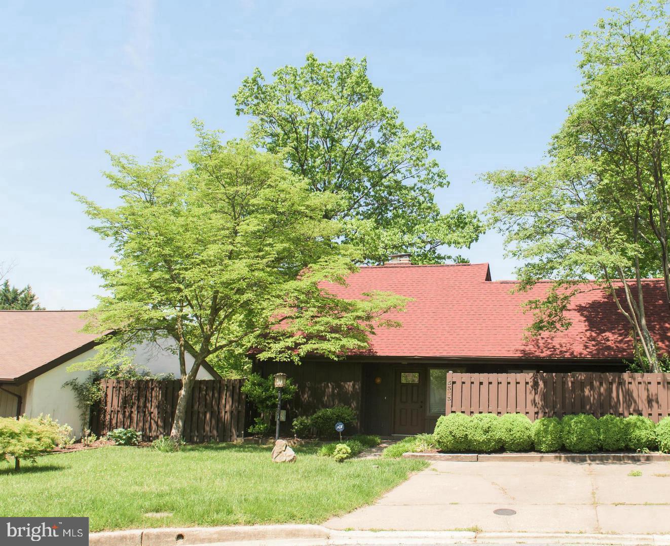 front view of a house with a garden