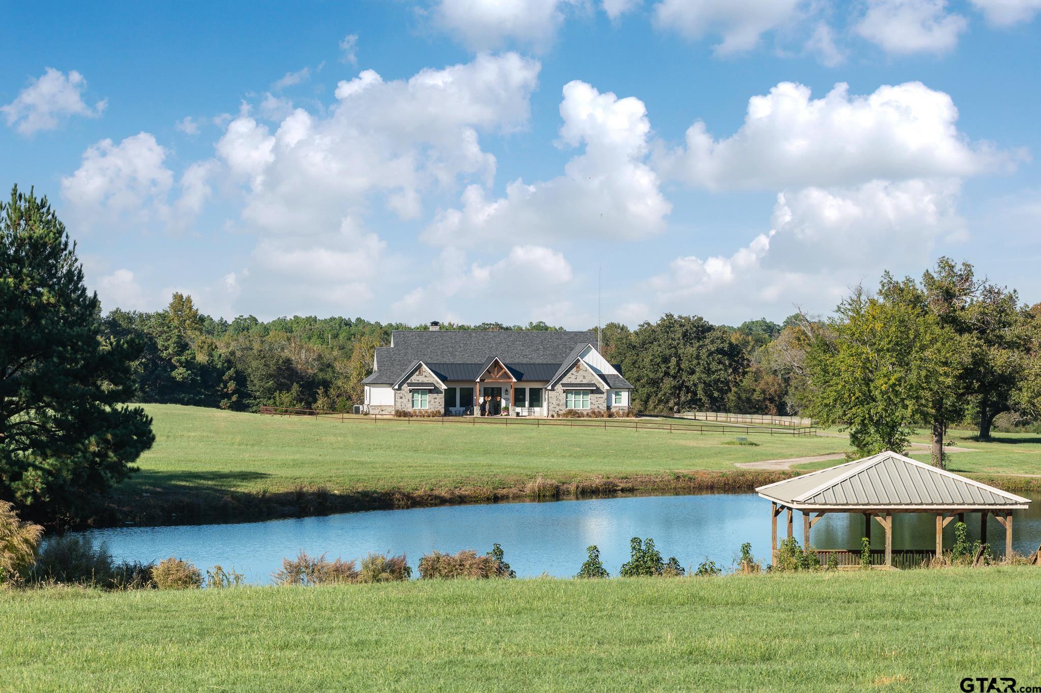 a view of a lake with a big yard