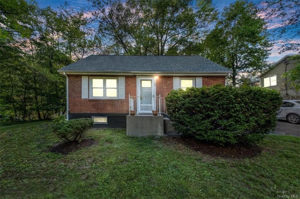 View of front of home with a lawn