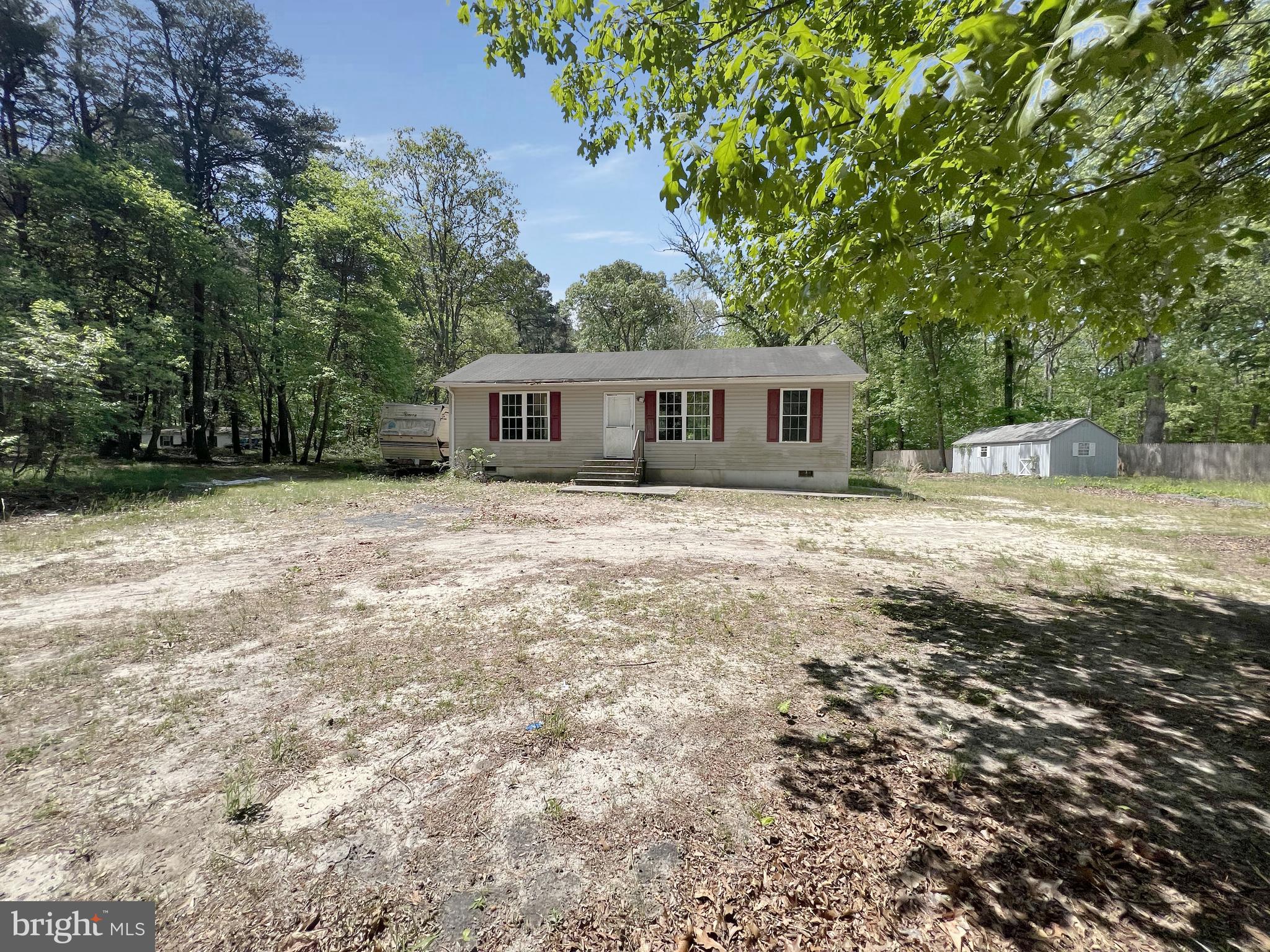 a house with trees in the background