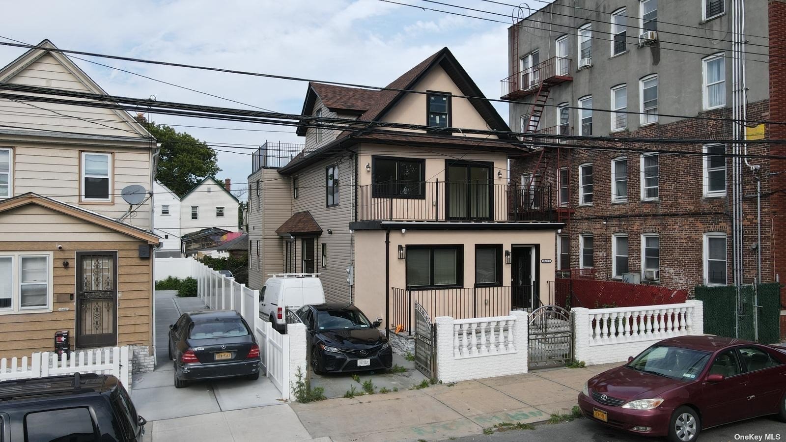 a front view of a house with parking space