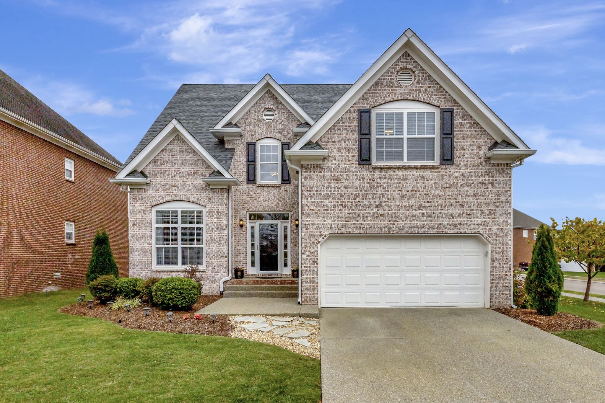 front view of a house with a yard