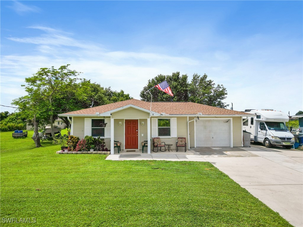 a front view of house with yard and green space