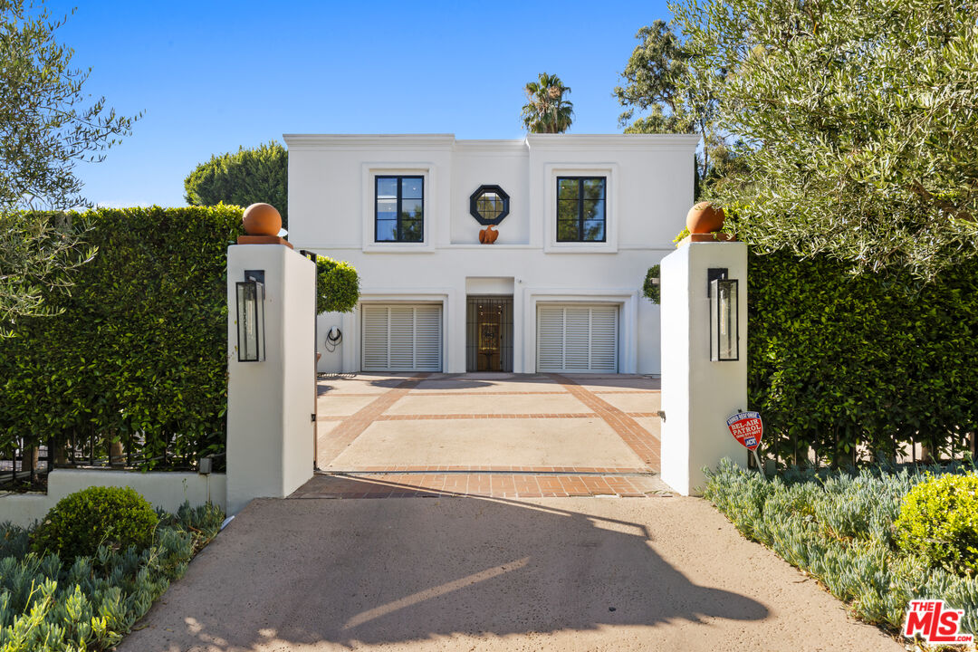 a front view of a house with yard