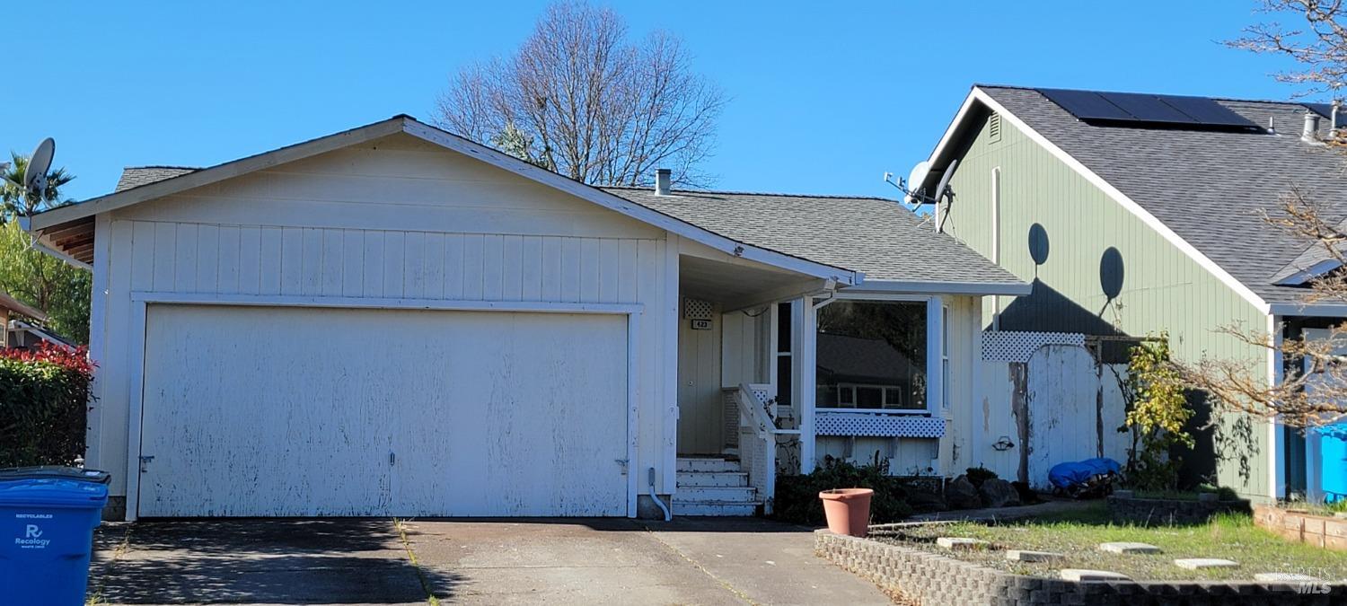 a view of house with yard