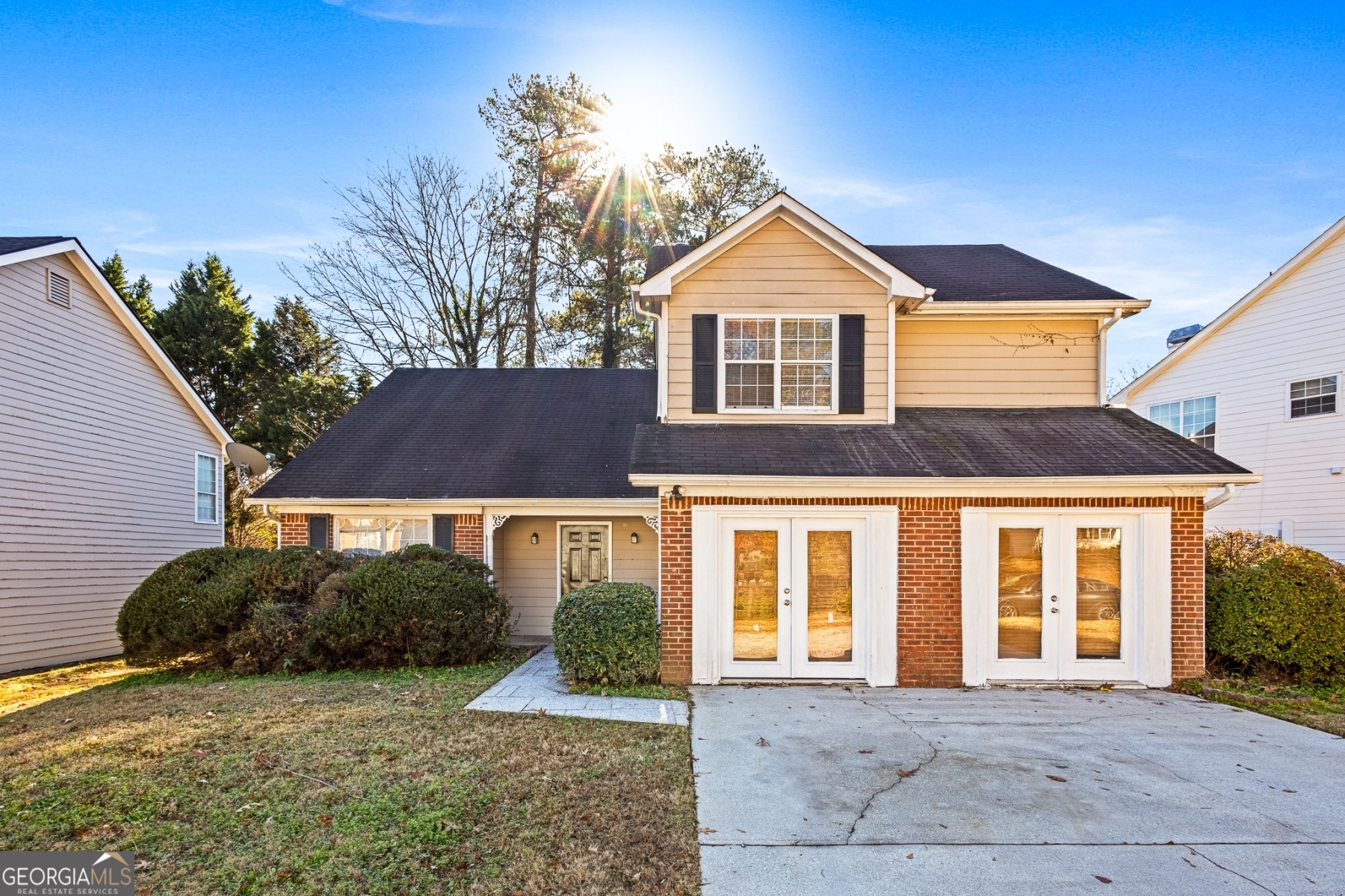 a front view of a house with a yard