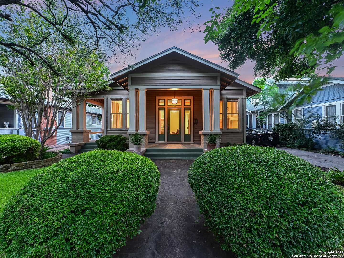 a front view of a house with garden