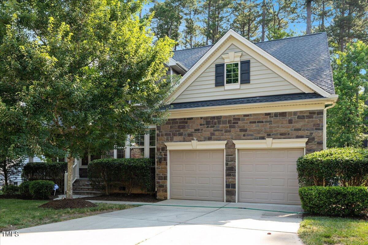 a front view of a house with garage