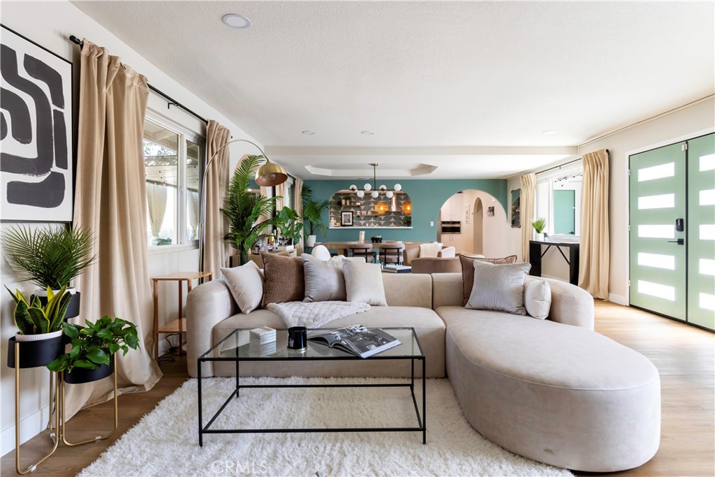 a living room with furniture and a large window