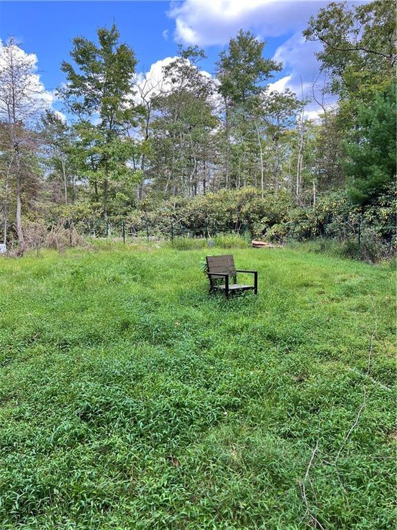 a view of a yard with a tree