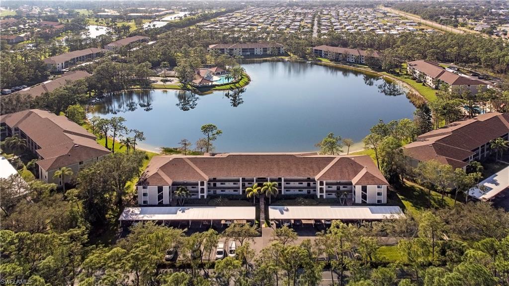 an aerial view of a house with a lake view