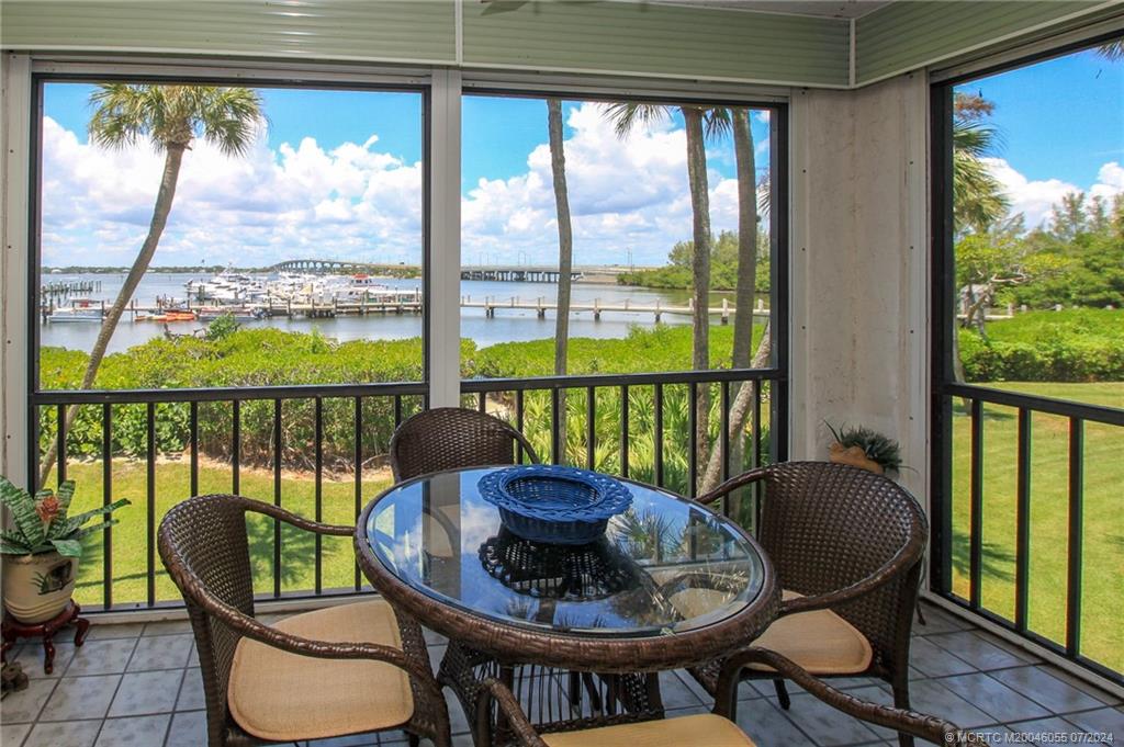 a view of a chairs and table in patio