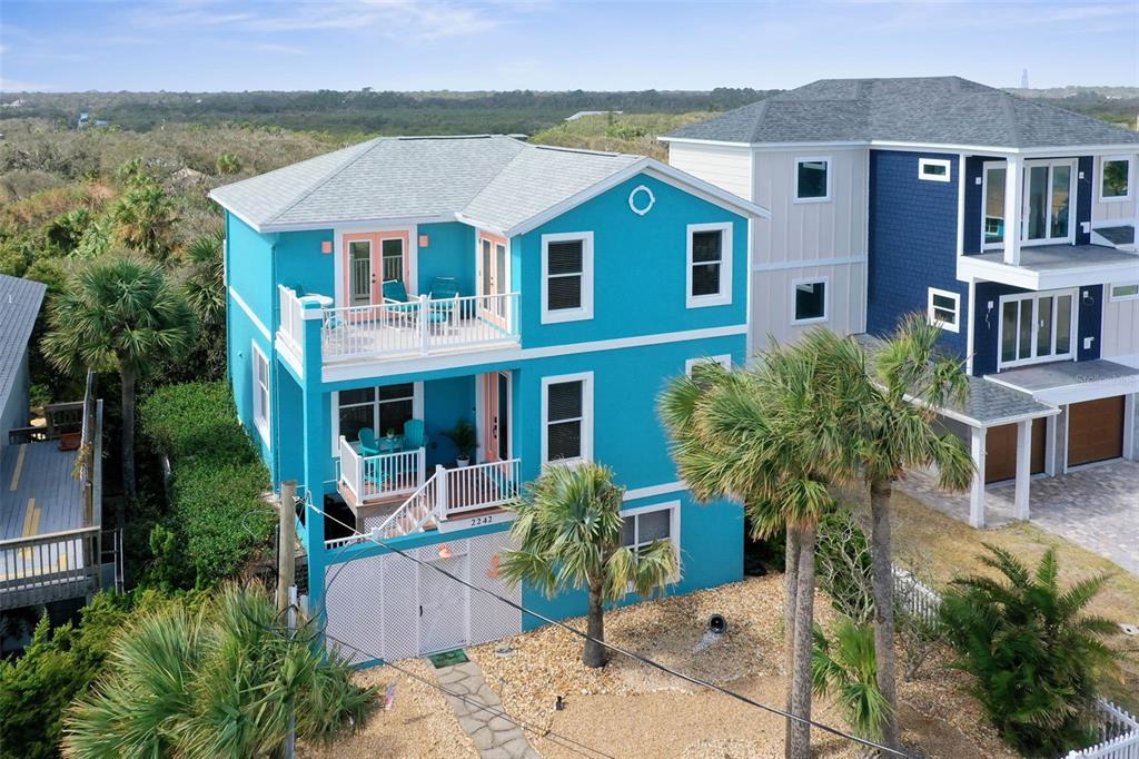 a aerial view of a house with a yard