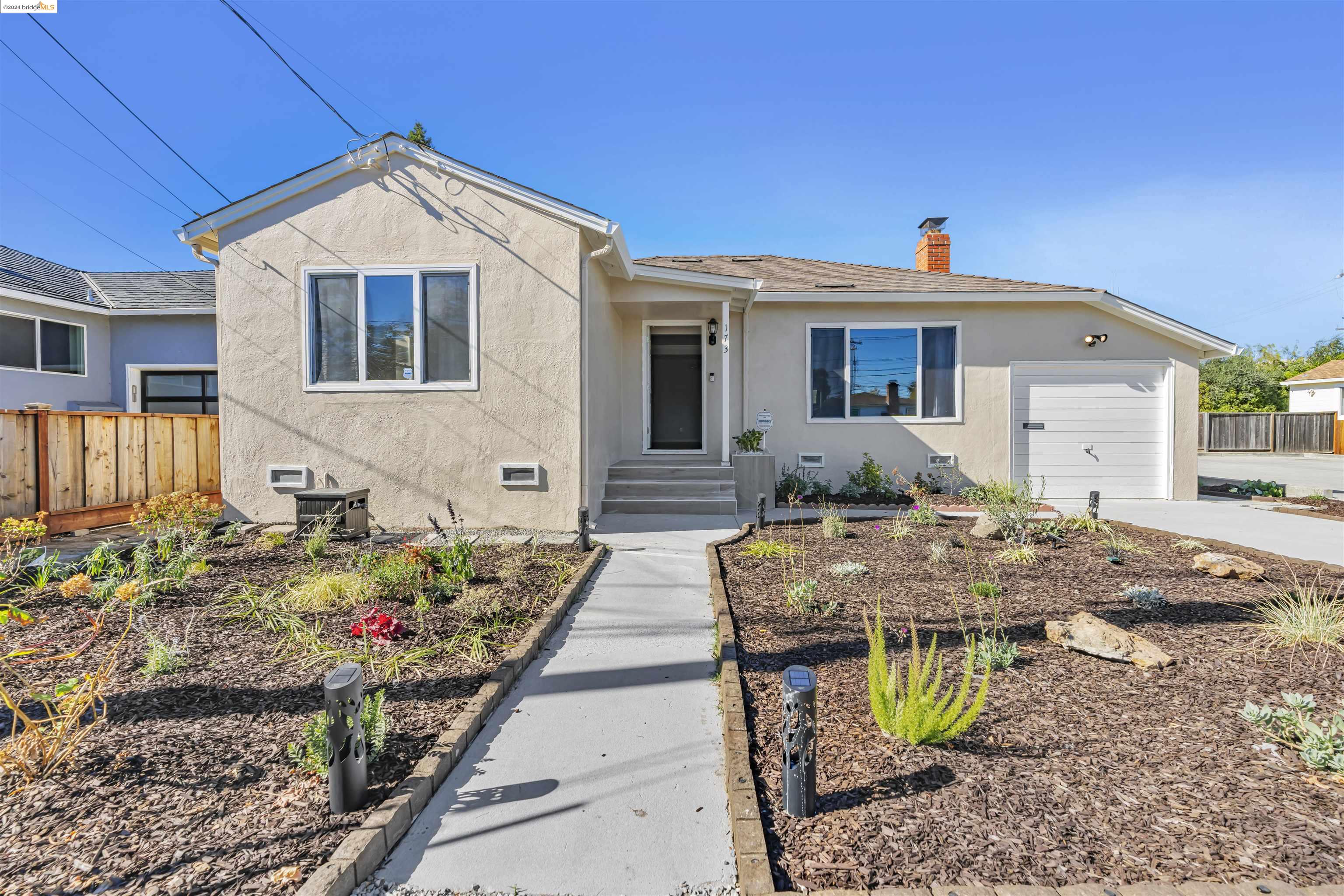 a front view of a house with yard