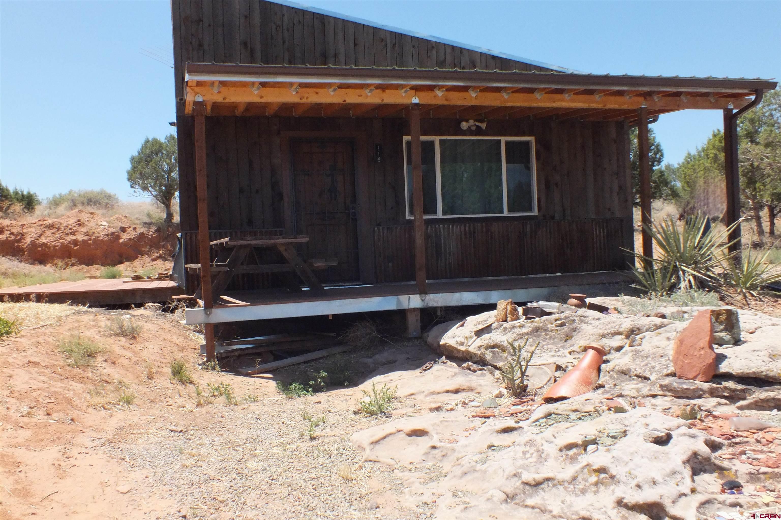 a view of a backyard of the house