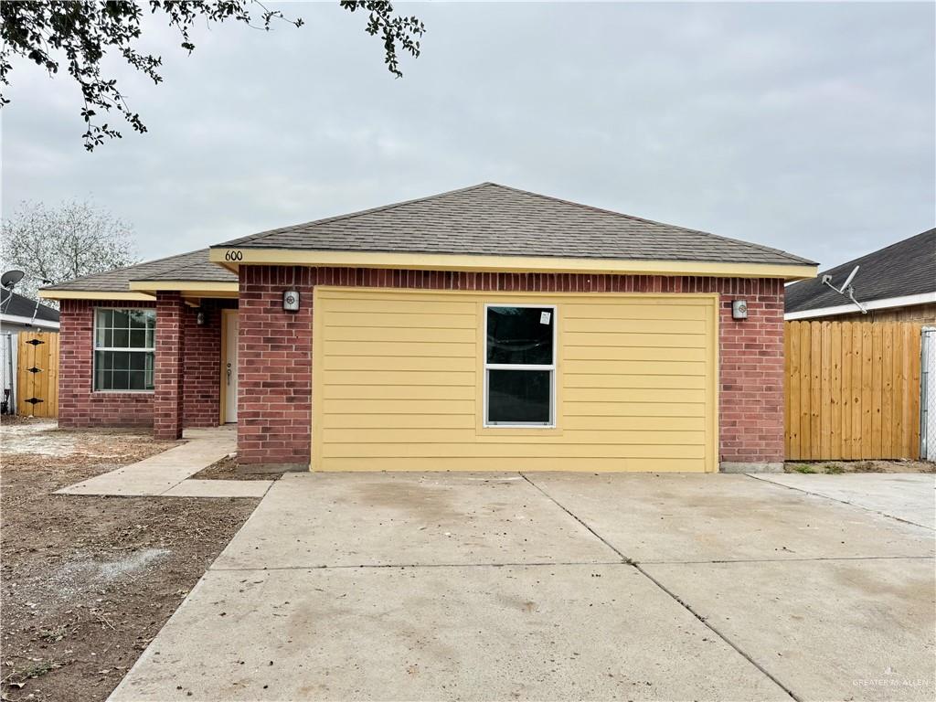 a front view of a house with a garage