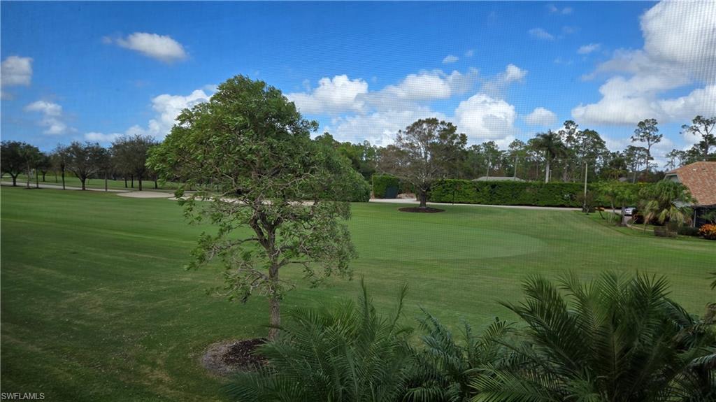 a view of a golf course with a lake