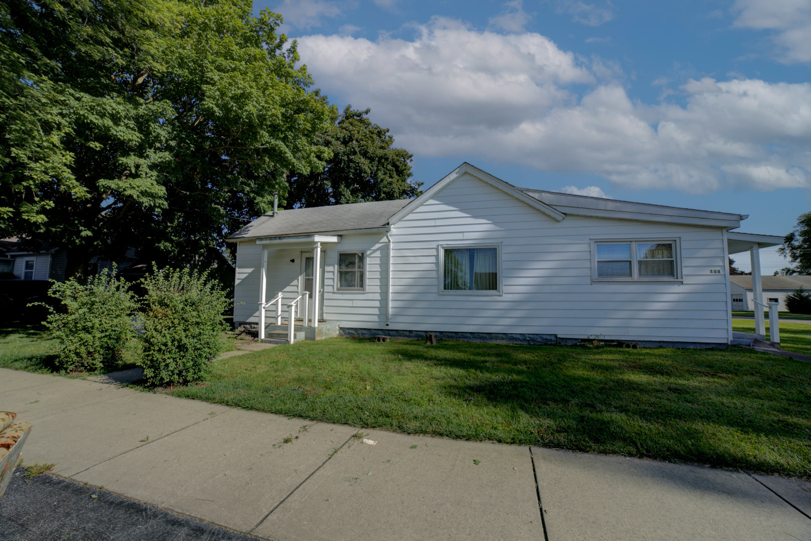 a view of a house with a backyard