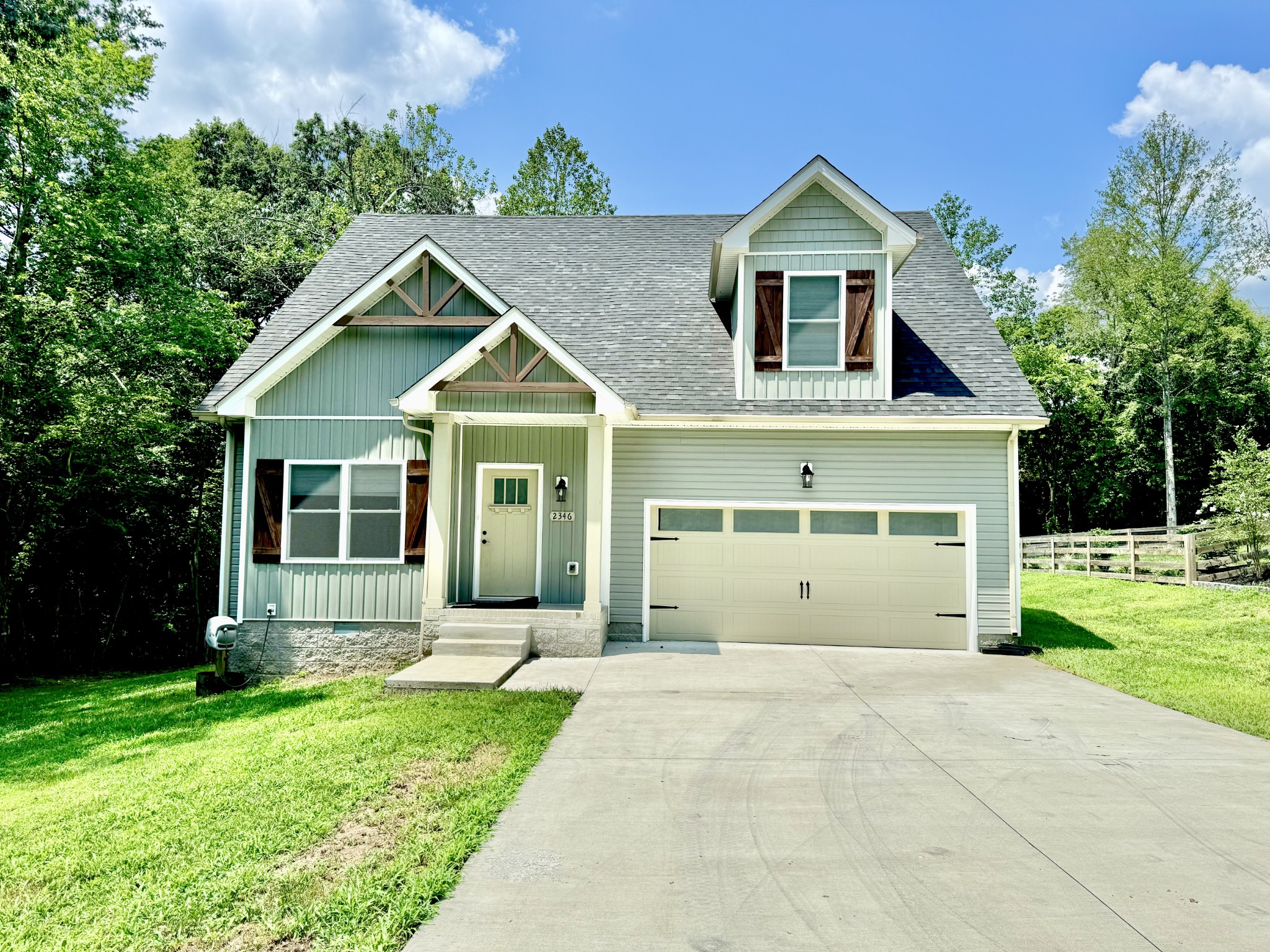 front view of a house with a yard