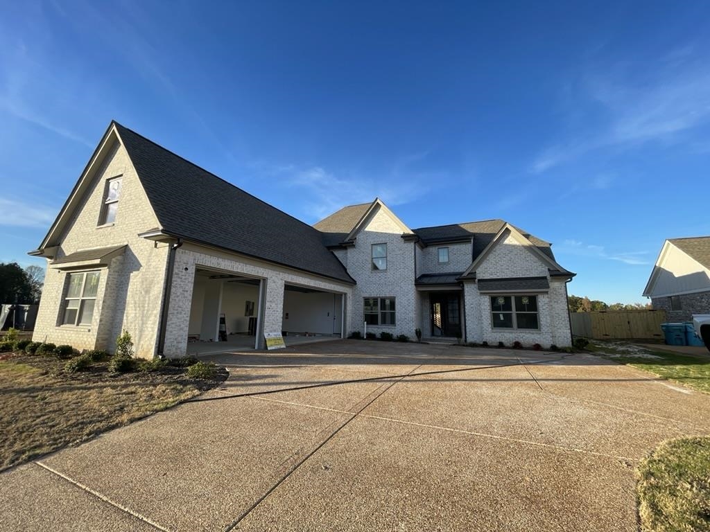 a front view of a house with a outdoor space