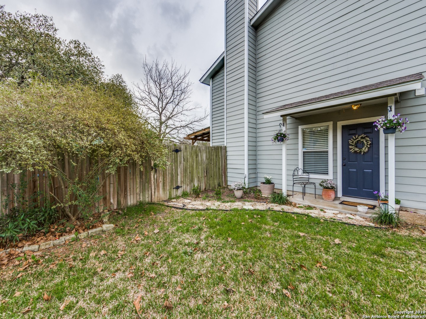 a front view of house with yard and seating space